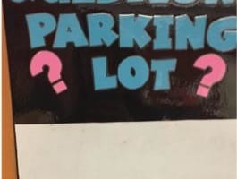 Laminated sign that reads Question Parking Lot? above white space