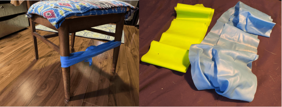 A blue band tied around the legs of a chair, a yellow and a gray band flat on the floor.
